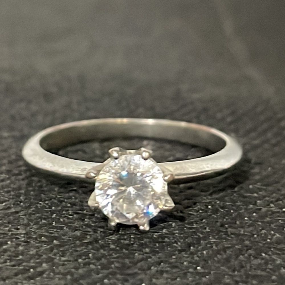 Large ring with a white gem